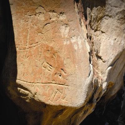 Glimpse into the past when you view the sandstone etchings at White Mountain.